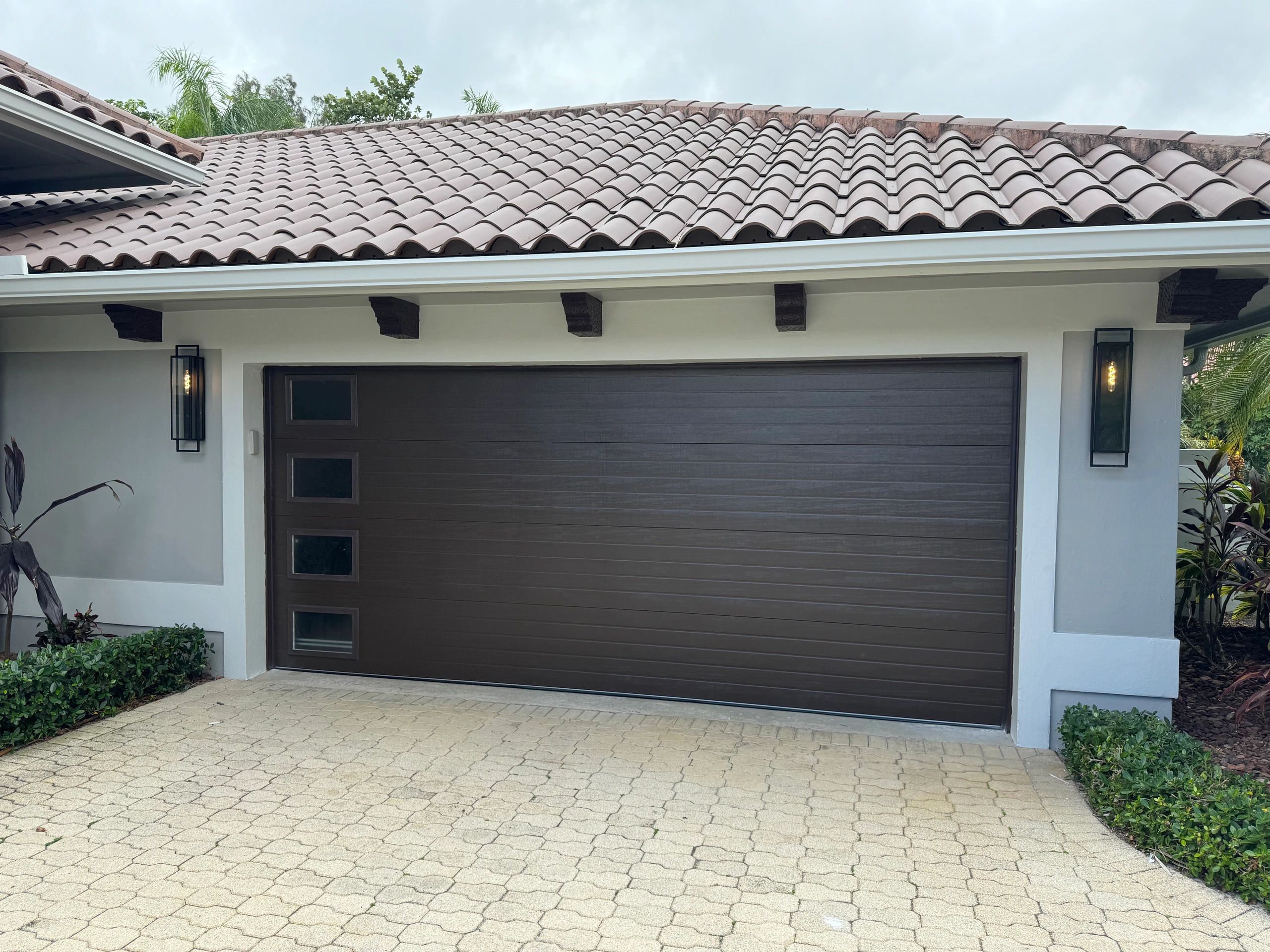 Charcoal garage door Mediterranean home